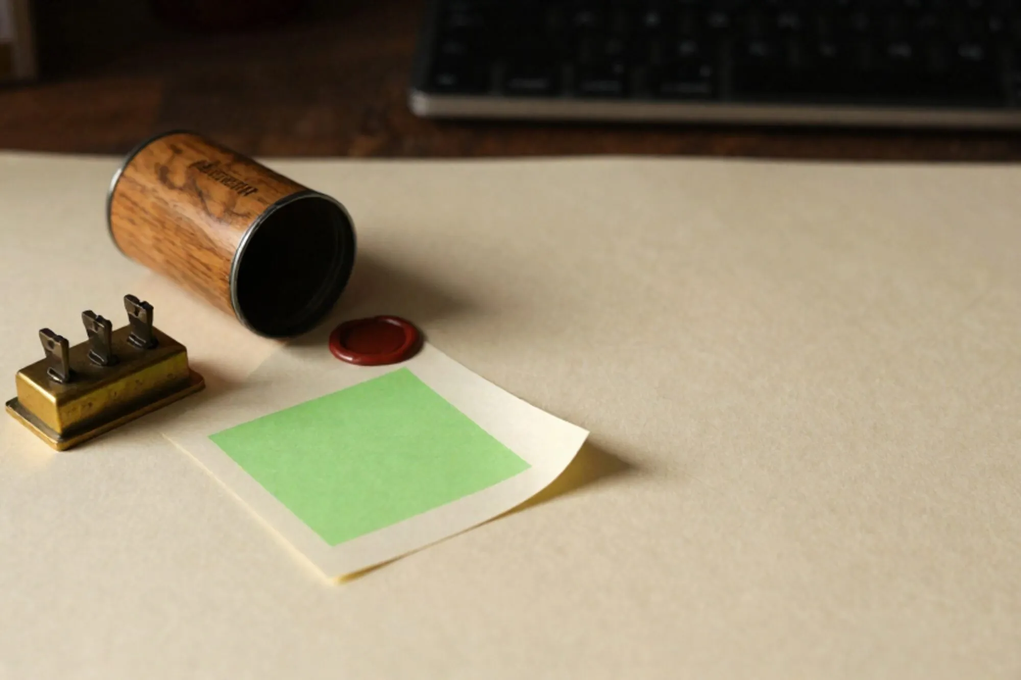 Brass relay with half-flipped switches, open wooden pneumatic canister, curled cream RFQ form, green sticky note, wax seal.