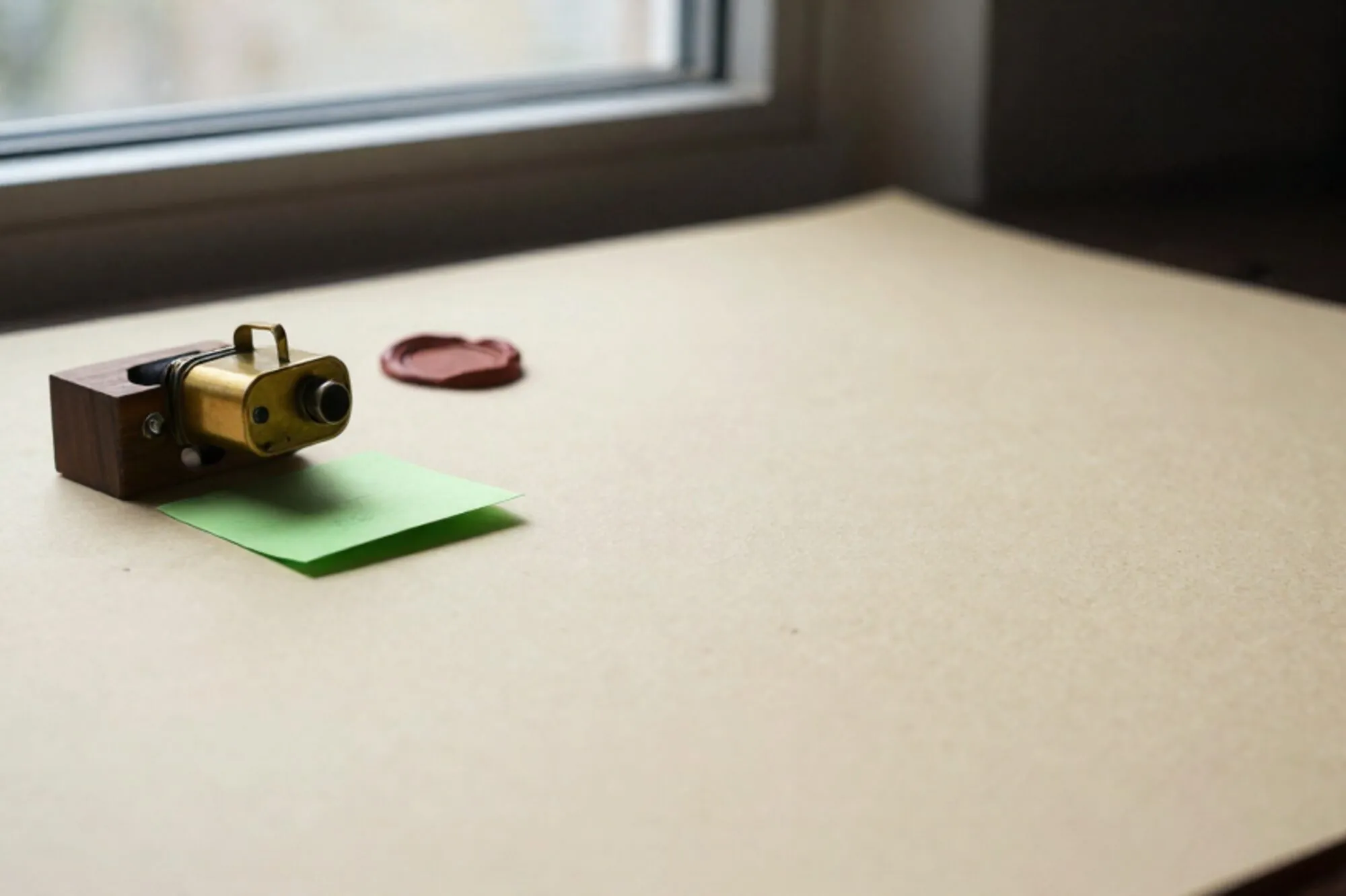 Brass relay switch, wooden patch-bay block, folded paper docket, chartreuse sticky note, wax seal on ivory paper.